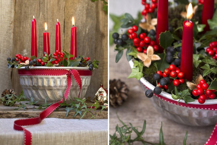 Ein selbst gemachter Adventkranz in der Gugelhupfform mit roten Kerzen und winterlichen Beerenfrüchten.